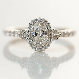 Delicate Clover Accented Oval Engagement Ring